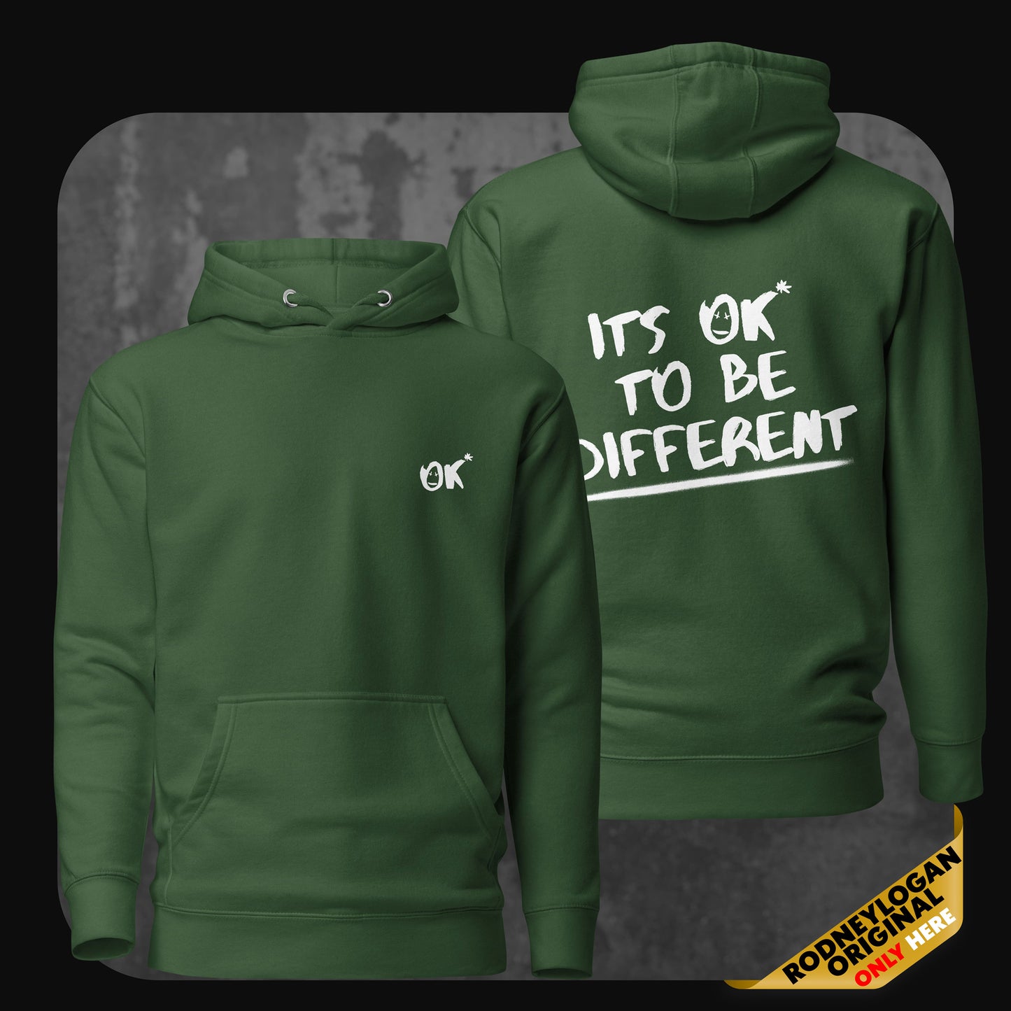 Product photo of a forest green hoodie featuring “OK*” front design and “IT’S OK TO BE DIFFERENT” back message.