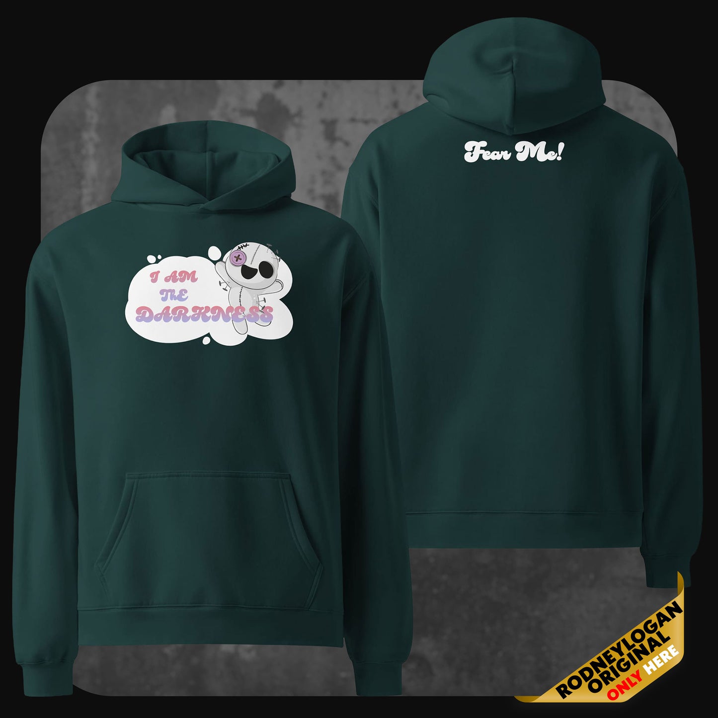 Front and back view of a dark green oversized hoodie featuring a cute cartoon skeleton on the front with the pink and white text “I AM THE DARKNESS” in a thought bubble. The back of the hoodie has the bold white text “Fear Me!” printed below the hood.