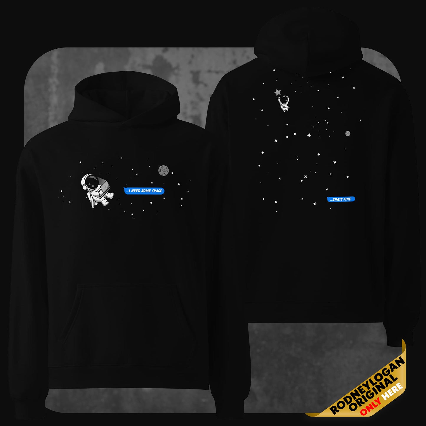 Front and back view of a black oversized hoodie featuring a minimalist outer space theme. The front shows a small cartoon astronaut floating in space with the text bubble “I NEED SOME SPACE” in blue. The back displays the astronaut drifting farther among stars with a reply bubble that says “THAT’S FINE” also in blue.