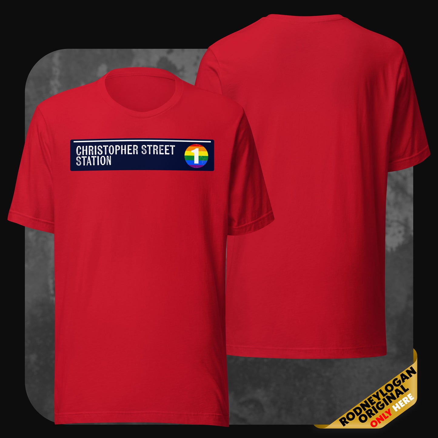 A red t-shirt sporting a white “Christopher Street Station” label and rainbow subway circle emblem across the chest; back is unprinted.