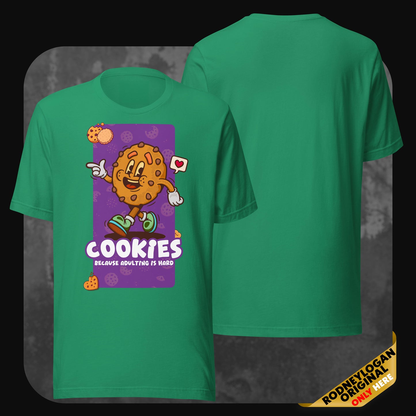 Green t-shirt with a fun illustrated cookie holding a love sign and the text “Cookies – Because adulting is hard” in bold white letters.