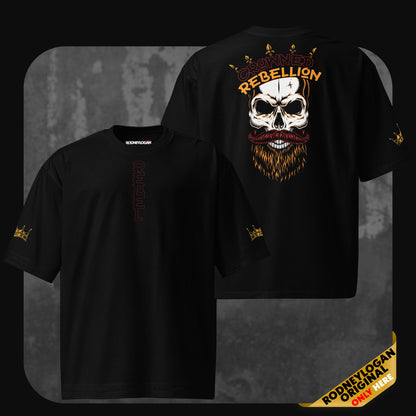 Flat front and back view of the black ‘Crowned Rebellion’ oversized t-shirt. The front includes a vertical ‘REBEL’ text and gold crown sleeve details, while the back showcases a crowned skull illustration with ‘CROWNED REBELLION’ in red and yellow letters.